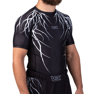 ABYSS SERIES rash guard worn by a model, three-quarter front view